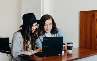 two young women on computer